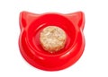 Cat wet food in a red bowl isolated on white. Royalty Free Stock Photo