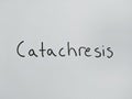 Catachresis - handwritten word on a white paper background