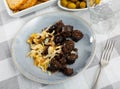 Catalan blood sausage morcilla garnished with baked onions