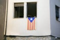 Catalan flag posted from the window of an apartment building in protest