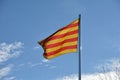 Catalan Senyera flag against a blue sky Royalty Free Stock Photo