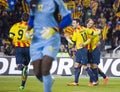 Catalan players celebrating a goal