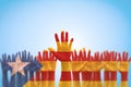 Catalan separatism concept with Senyera estelada Eastern Catalan flag on Catalunya people`s hand open palms isolated