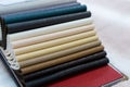 Catalog of multicolored imitation leather. Leatherette samples texture