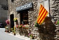 The Catalonian flag hangs outside a bakery on a pretty street in the pretty walled town of Villfranche de Conflent