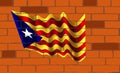 The Catalunya flag on wall of bricks