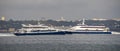 catamaran boat named Castelo da Transtejo crossing with catamaran boat named Fernando Pessoa