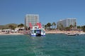 Playa den Bossa, Ibiza, Spain - Jul 5, 2017: Catamaran of boat party at ferry mooring Royalty Free Stock Photo