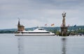 The catamaran Ferdinand and lighthouse (Imperia statue) at the entrance of the harbour of Constance, Bodensee lake, German Royalty Free Stock Photo