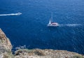 Catamaran and motor boat from cliff at Akrotiri