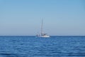 Catamaran navigating along the coast in Portinho da Arrabida, Portugal