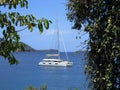 Catamaran Sailboat in Calm Tropical Bay Royalty Free Stock Photo