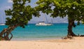 The catamaran and sailboats anchored in waters of caribbean beach. Royalty Free Stock Photo