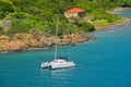 Catamaran sailing by Garrison House at Fort Willoughby on Hassel Island, St Thomas U.S. Virgin Islands.