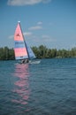 Catamaran sailing on the lake of reiningue Royalty Free Stock Photo