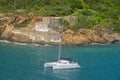 Catamaran sailing by Prince Frederikas Battery. Fort Willoughby on Hassel Island, St Thomas U.S. Virgin Islands.