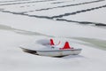 Catamaran on the snowy shore