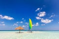 Catamaran on tropical sandbank island with sunshade, Maldives. Indian Ocean Royalty Free Stock Photo