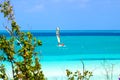 Catamaran on the turquoise water of the Caribbean with a bright blue sky