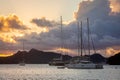 Catamarans and yachts anchored at Tobago Cays in sunset rays, Saint Vincent and the Grenadines, Caribbean sea