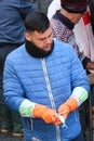 Catania, Italy - Apr 10th 2019: Young man fishmonger gutting fish on a traditional Sicilian fish market. Pulling out of roe