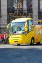 Catania, Sicily, Italy - Apr 10th 2019: Open, yellow hop on hop off tourist bus with tourists in Piazza Duomo square in the city Royalty Free Stock Photo