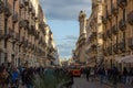 Catania via etnea street view, baroque city center with tourist train and people Royalty Free Stock Photo