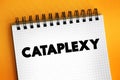 Cataplexy is a sudden muscle weakness that occurs while a person is awake, text on notepad Royalty Free Stock Photo