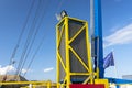 The catapult tensioning mechanism made of many springs and hydraulic cylinders against the blue sky.