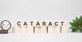 CATARACT word made with wooden blocks concept