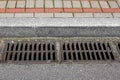 Catch basin grate of the lattice of the drain system for drainage of rainwater. Royalty Free Stock Photo