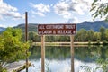 A catch and release sign for Cutthroat Trout along the Coeur d`Alene River near Cataldo, Idaho, part of the Silver Valley. Royalty Free Stock Photo