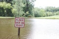 Catch and release sign in a pond Royalty Free Stock Photo