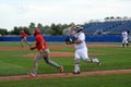 Catcher chasing runner from third