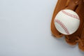 Catcher`s mitt and baseball ball on white background, top view with space for text. Sports game Royalty Free Stock Photo