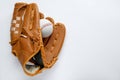 Catcher\'s mitt and baseball ball on white background, top view with space for text. Sports game Royalty Free Stock Photo