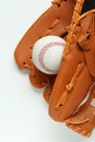 Catcher\'s mitt and baseball ball on white background, top view. Sports game