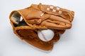 Catcher`s mitt and baseball ball on white background, top view. Sports game Royalty Free Stock Photo