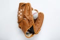 Catcher\'s mitt and baseball ball on white background, top view. Sports game Royalty Free Stock Photo