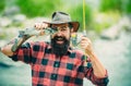 Catches a fish. Fishes catching hooks. Fishing in river. Fly fishing for trout. Rainbow trout on a hook. Fly rod and Royalty Free Stock Photo