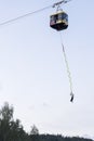 Catching adrenaline - bungee jumping of cable car over river Gauja in Latvia