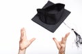 Catching black student graduation hat Royalty Free Stock Photo