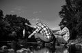 Catching fish. Young and old fisherman standing on the shore of lake with fishing rod. Father and son enjoy life. Men Royalty Free Stock Photo