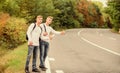 Catching rides. stop car with thumb up gesture. hitchhiking and stopping car with thumbs up gesture at countryside. On Royalty Free Stock Photo