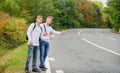 Catching rides. stop car with thumb up gesture. hitchhiking and stopping car with thumbs up gesture at countryside. On Royalty Free Stock Photo