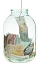 Catching saving euro money from glass jar Royalty Free Stock Photo