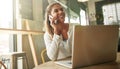 Catching up on some emails. an attractive young woman in a coffee shop.