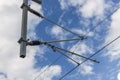 Catenary support in front of cloudy sky Royalty Free Stock Photo