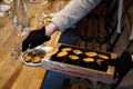 Caterer Arranging Gourmet Tartlets for Event