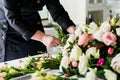 caterer decorating table with fresh flowers Royalty Free Stock Photo